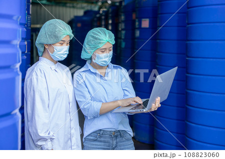 Water quality control officer engineer team inspect water tanks in beverage industry factory for ensure cleanliness standards. 108823060