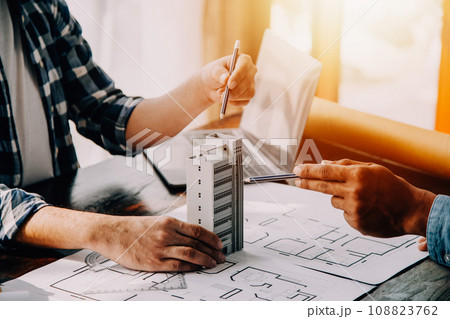 Construction and structure concept of engineer working drawing on blueprint meeting for project working with partner on model building and engineering tools in working site, construction concept. Construction and structure concept of engineer working drawing on blueprint meeting for project working with partner on model building and engineering tools in working site, construction concept. 108823762