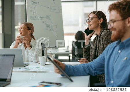 Businesspeople working together in modern coworking sitting at desk. Teamwork concept 108825921