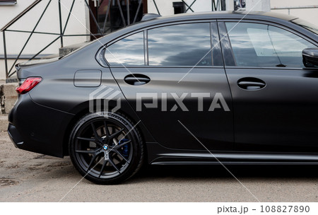 Black BMW wrapped in matte vinyl wrap 108827890