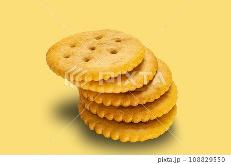 High angle view stack of salted round crackers. High angle view stack of salted round crackers. 108829550