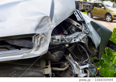 silver car nose smashed in an accident at day time 108830494
