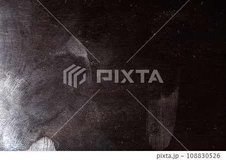 black surface with dust and oily fingerprints 108830526
