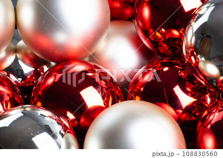 Christmas mirror balls, full frame background of red, silver and white, close-up. 108830560