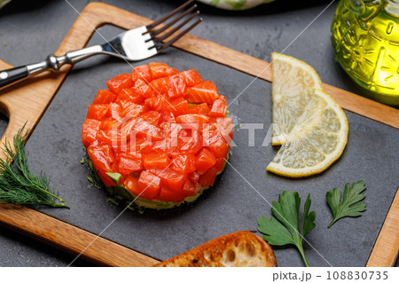 Delicious salmon and avocado tartare Delicious salmon and avocado tartare 108830735