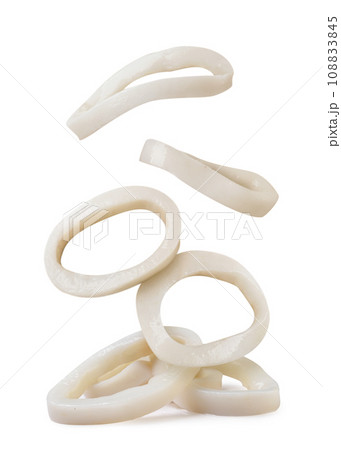 Squid rings falling on a pile on a white background. Isolated 108833845