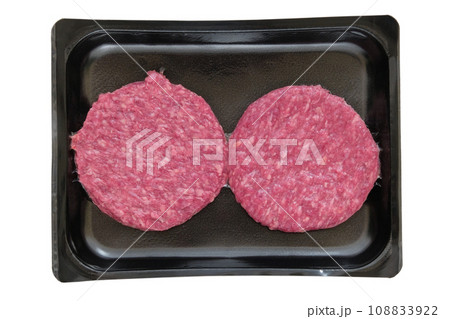 Cooking a burger. Mince in black container isolated on white background. Minced meat. Cooking a burger. Mince in black container isolated on white background. Minced meat. 108833922