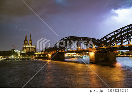 Lightning and dramatic storm clouds over Cologne Cathedral and Hohenzollern Bridge Lightning and dramatic storm clouds over Cologne Cathedral and Hohenzollern Bridge 108838213