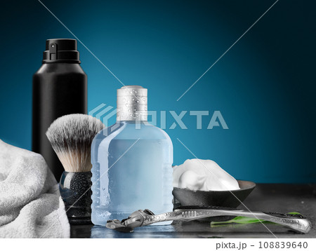 Shaving razor and accessories set on a blue background Shaving razor and accessories set on a blue background 108839640
