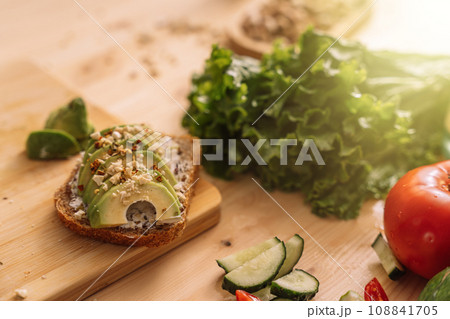 Fresh vegetables in white plates and on a wooden table Fresh vegetables in white plates and on a wooden table 108841705