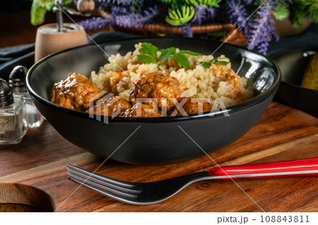 Meatballs pork and mashed potatoein paprika gravy served with groats bulgur. Meatballs pork and mashed potatoein paprika gravy served with groats bulgur. 108843811