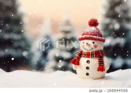 Cute little snowman in knitted hat and scarf standing outside on a winters day Cute little snowman in knitted hat and scarf standing outside on a winters day 108844506
