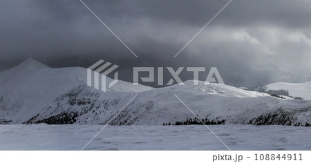 Winter mountain view in Carpathian mountains with dramatic clouds 108844911