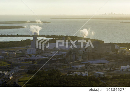 Industrial facility for chemical production of phosphoric acid polluting atmosphere with toxic emissions. Mosaic Riverview Plant in Tampa, Florida. Factory for handling and processing of phosphates Industrial facility for chemical production of phosphoric acid polluting atmosphere with toxic emissions. Mosaic Riverview Plant in Tampa, Florida. Factory for handling and processing of phosphates 108846274