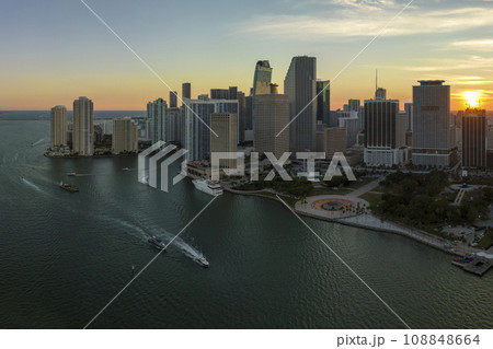 Aerial view of downtown district of of Miami Brickell in Florida, USA at sunset. High commercial and residential skyscraper buildings in modern american megapolis 108848664