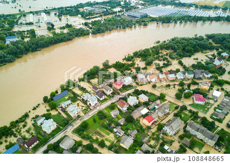Aerial view of Dnister river with dirty water and flooded houses in Halych town, western Ukraine. Aerial view of Dnister river with dirty water and flooded houses in Halych town, western Ukraine. 108848665