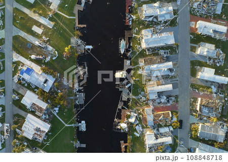 Aerial view of badly damaged mobile homes after hurricane Ian swept through residential area in Florida. Aftermath of natural disaster 108848718