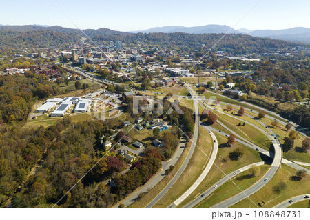Aerial view of american freeway intersection in fall season in Asheville, North Carolina with fast moving cars and trucks. USA transportation infrastructure concept 108848731
