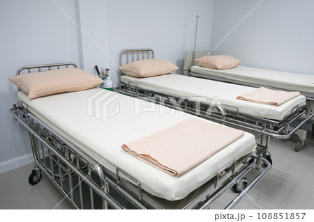 Recovery Room with bed and comfortable medical equipped in a hospital. Mattress with white cloth Recovery Room with bed and comfortable medical equipped in a hospital. Mattress with white cloth 108851857