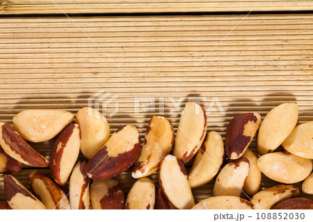 Brazil nuts on wooden background 108852030
