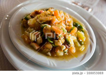 Mediterranean cuisine food, stewed prawns, mussels, calamari with vegetables 108853069