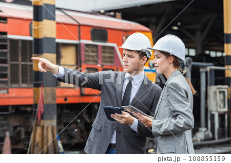 business investor engineer team working survey at site outdoor old locomotive depot diesel train yard plan for renovate business investor engineer team working survey at site outdoor old locomotive depot diesel train yard plan for renovate 108855159
