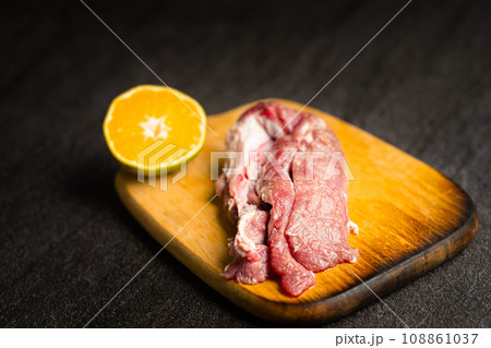 Lamb placed on a black marble slab. Lamb placed on a black marble slab. 108861037