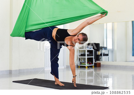 Young woman making aerial or fly yoga pose Young woman making aerial or fly yoga pose 108862535