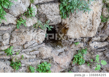 Hole in the wall of limestone Hole in the wall of limestone 108864205