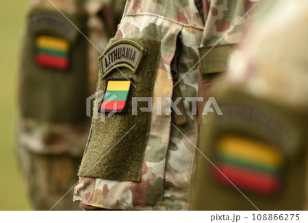 Lithuania patch flag on soldiers arm. Lithuanian military uniform. Lithuania troops Lithuania patch flag on soldiers arm. Lithuanian military uniform. Lithuania troops 108866275