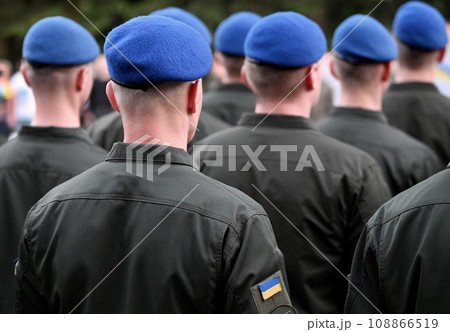 Ukrainian soldiers. Ukrainian army. Ukrainian flag on military uniform. Troops of Ukraine. Soldier from the back 108866519
