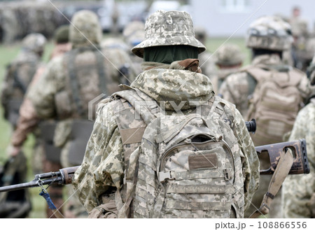 Soldiers with assault rifles from the back. Soldiers with assault rifles from the back. 108866556