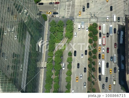 View from skyscrapers on the streets of New York City. Top view on the street with cars on the road View from skyscrapers on the streets of New York City. Top view on the street with cars on the road 108866715