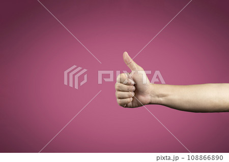 Thumb up symbol on vignetting dark pink background for banner advertising., Clipping Paths. 108866890