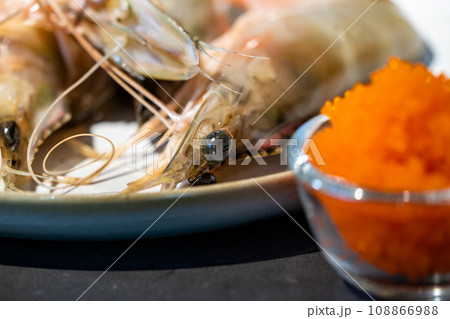 Focused on fresh Shrimp eye with blur tobiko beside. Focused on fresh Shrimp eye with blur tobiko beside. 108866988