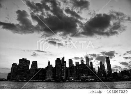 New York cityscape. New York City, financial district in lower Manhattan view from Brooklyn Bridge Park. 108867020