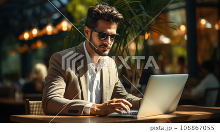 Work remotely without being tied to an office or outsource a specialist for business efficiency. Young businessman in glasses works on a laptop in an office space 108867055