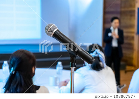 microphone is on microphone stand in seminar meeting room for everyone to use when speaking or greeting seminar participants. microphone is on microphone stand in seminar meeting room for everyone to use when speaking or greeting seminar participants. 108867977