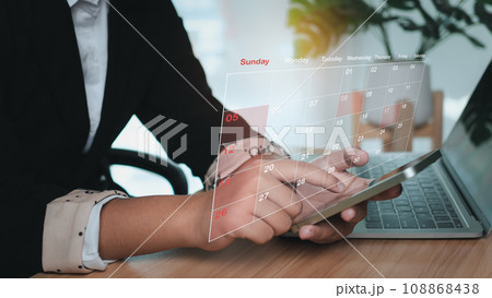 Businesswoman marking dates on virtual calendar, managing his business schedule, setting reminders for important appointments, creative collage for planning ideas, appointment scheduler Businesswoman marking dates on virtual calendar, managing his business schedule, setting reminders for important appointments, creative collage for planning ideas, appointment scheduler 108868438