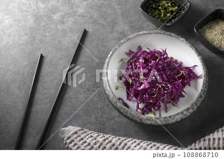 Red cabbage salad with sesame seeds, micro greens and sauce. Red cabbage salad with sesame seeds, micro greens and sauce. 108868710