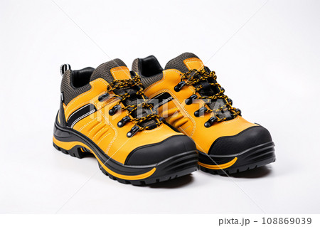 Pair of yellow safety leather shoes isolated on white background. Work shoes for men in factory or industry to protect foot from accident. Safety footwear. Oil and acid resistant shoes. Generative AI 108869039