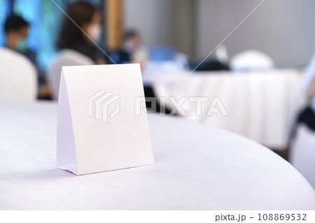 Triangular shaped table sign is placed on the table for scanning QR codes as an announcement, reservation sign, or menu at the seminar. 108869532