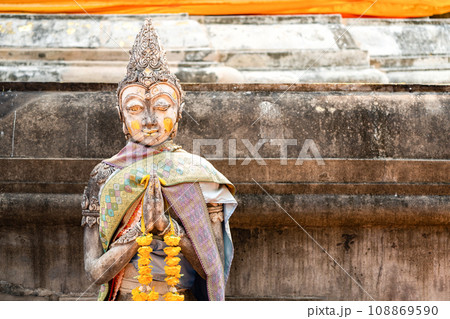 Vintage Stone Traditional Statue in Woman Character at backside of Wat Phra That Chom Kitti, a worship place at Chiang Rai, Thailand. 108869590