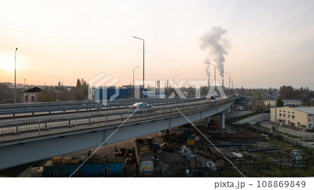 Drone view of the bridge passing through the city. Drone view of the bridge passing through the city. 108869849