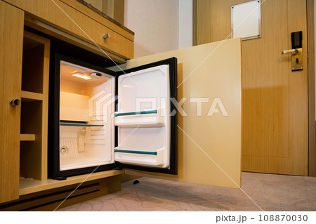 a refrigerator under the bar counter, according to the appearance of the refrigerator, it is a small size that is found only at the hotel, and can only hold a limited amount of stuff. a refrigerator under the bar counter, according to the appearance of the refrigerator, it is a small size that is found only at the hotel, and can only hold a limited amount of stuff. 108870030