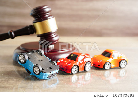 Bangkok, Thailand March 15, 2023 Car accident lawsuit and insurance, Judge hammer with car model. Bangkok, Thailand March 15, 2023 Car accident lawsuit and insurance, Judge hammer with car model. 108870693
