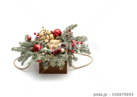 Beautiful Christmas composition isolated on white background with copy space. Christmas bouquet with fir branches, red and gold decor. New Year decorations. 108870893
