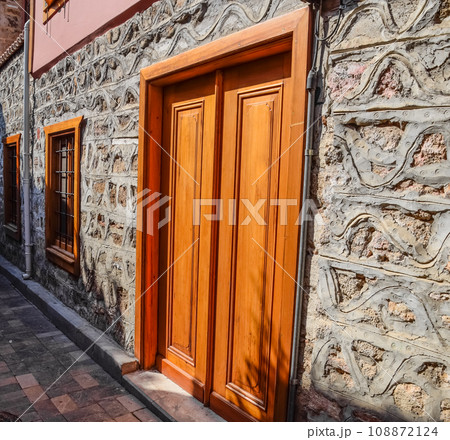 Vintage wooden gate door in old building of the historic town of Kaleici. Vintage wooden gate door in old building of the historic town of Kaleici. 108872124