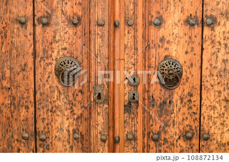 Vintage wooden gate door in old building of the historic town of Kaleici. Vintage wooden gate door in old building of the historic town of Kaleici. 108872134