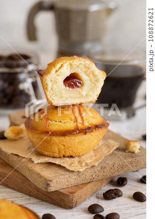 Pasticciotto leccese pastry filled with egg custard cream and sour cherry jam close up 108872621